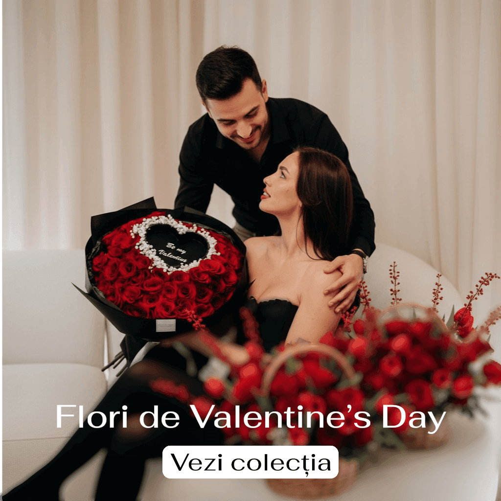 Flori de Valentine’s Day – vezi colecția. Cuplu oferă un buchet de trandafiri roșii.